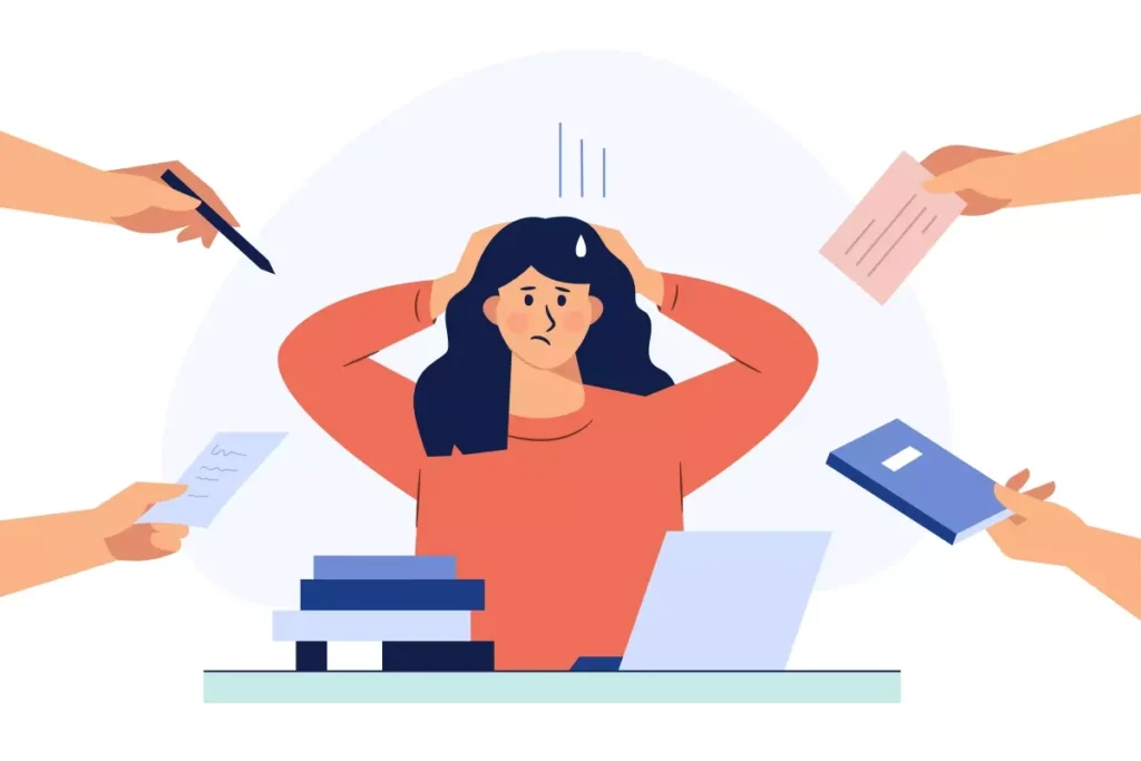 Pessoa preocupada no computador com múltiplos dispositivos e documentos em um ambiente de trabalho, ilustrando direitos da empregada doméstica em caso de demissão.